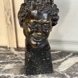 Head of a faun smiling, bronze after the antique, 19th century.