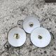 Trio in white green enamelled sheet hanging lamps