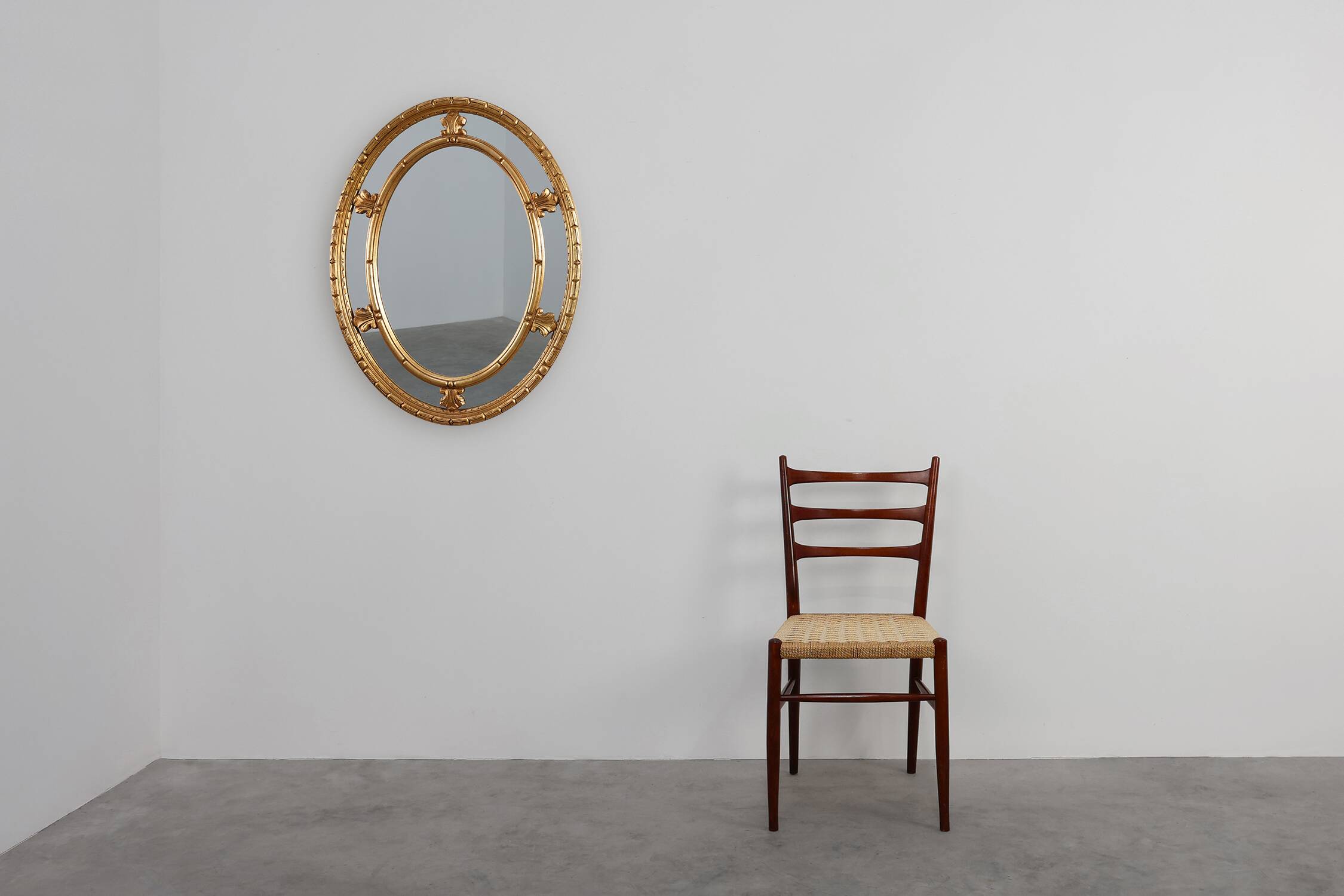 20th century neo-classical style tilted oval mirror by Deknudt, Belgium