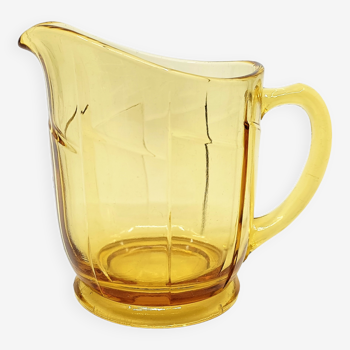 Small pitcher in amber yellow glass in art deco style