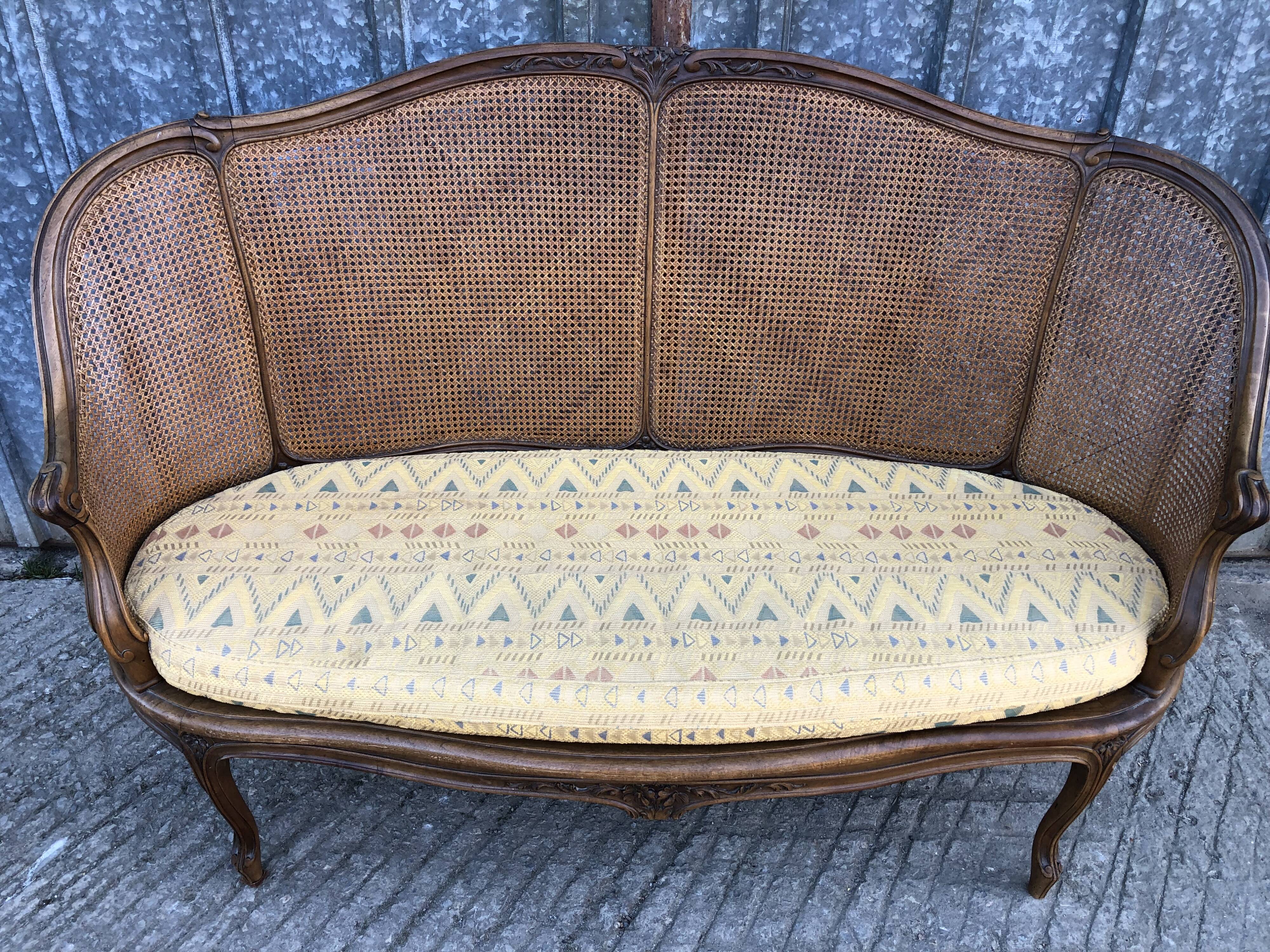 Antique Louis XV bench in solid walnut and caning