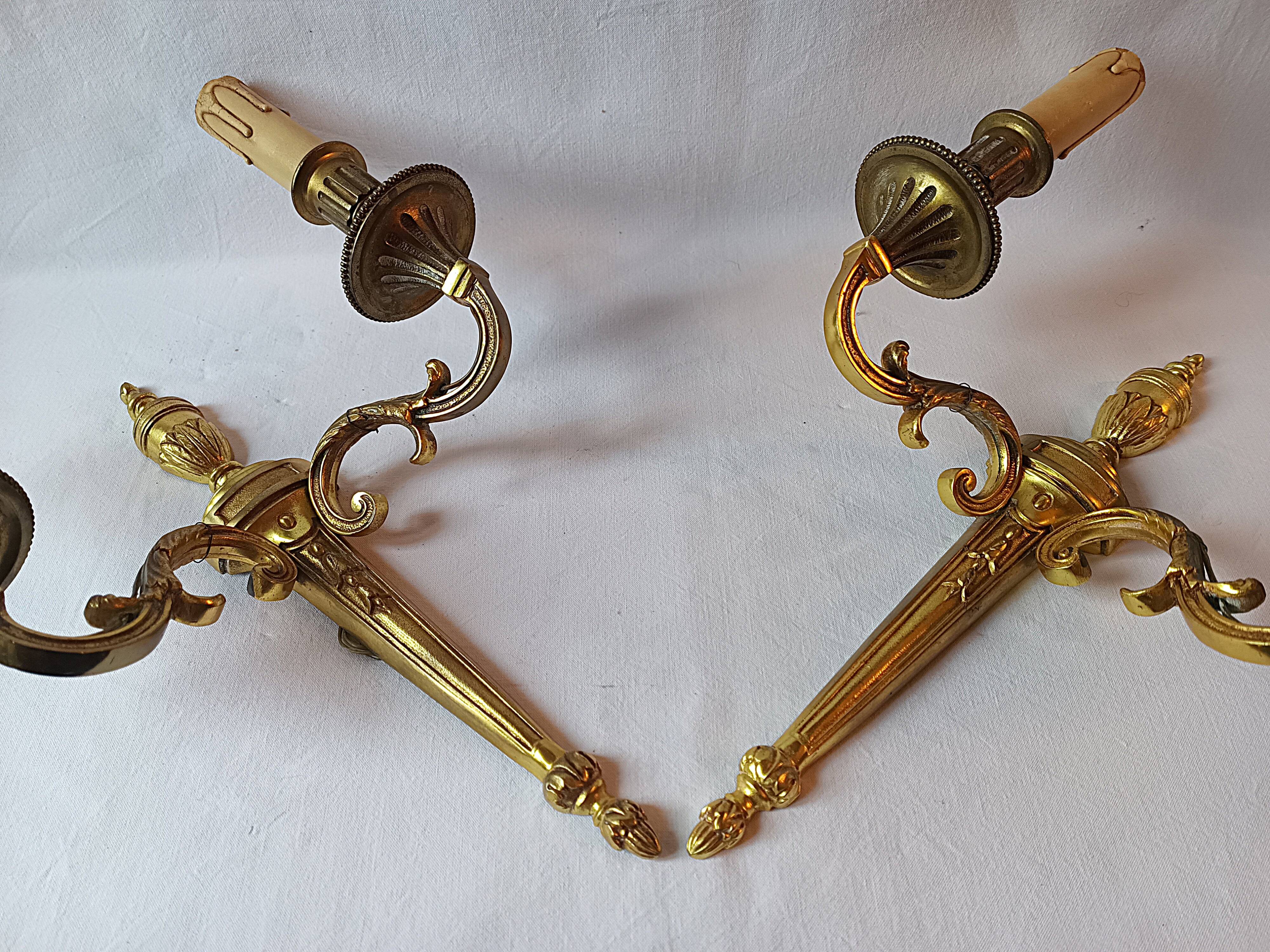 Pair of bronze wall sconces in Louis XVI style