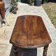 Round dining table with a drop-leaf top in solid walnut, late 19th century.