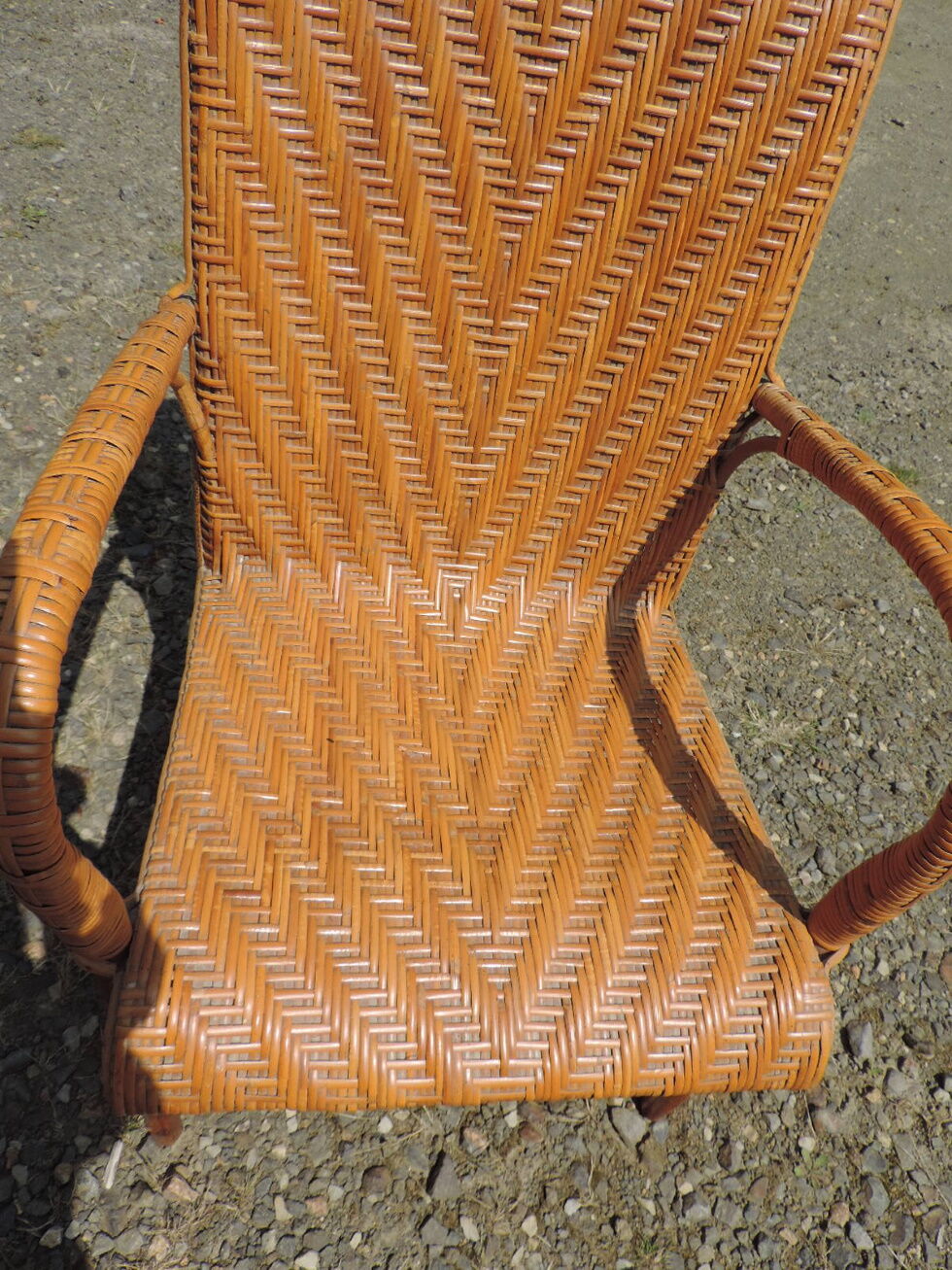 Rattan armchair with high backrest