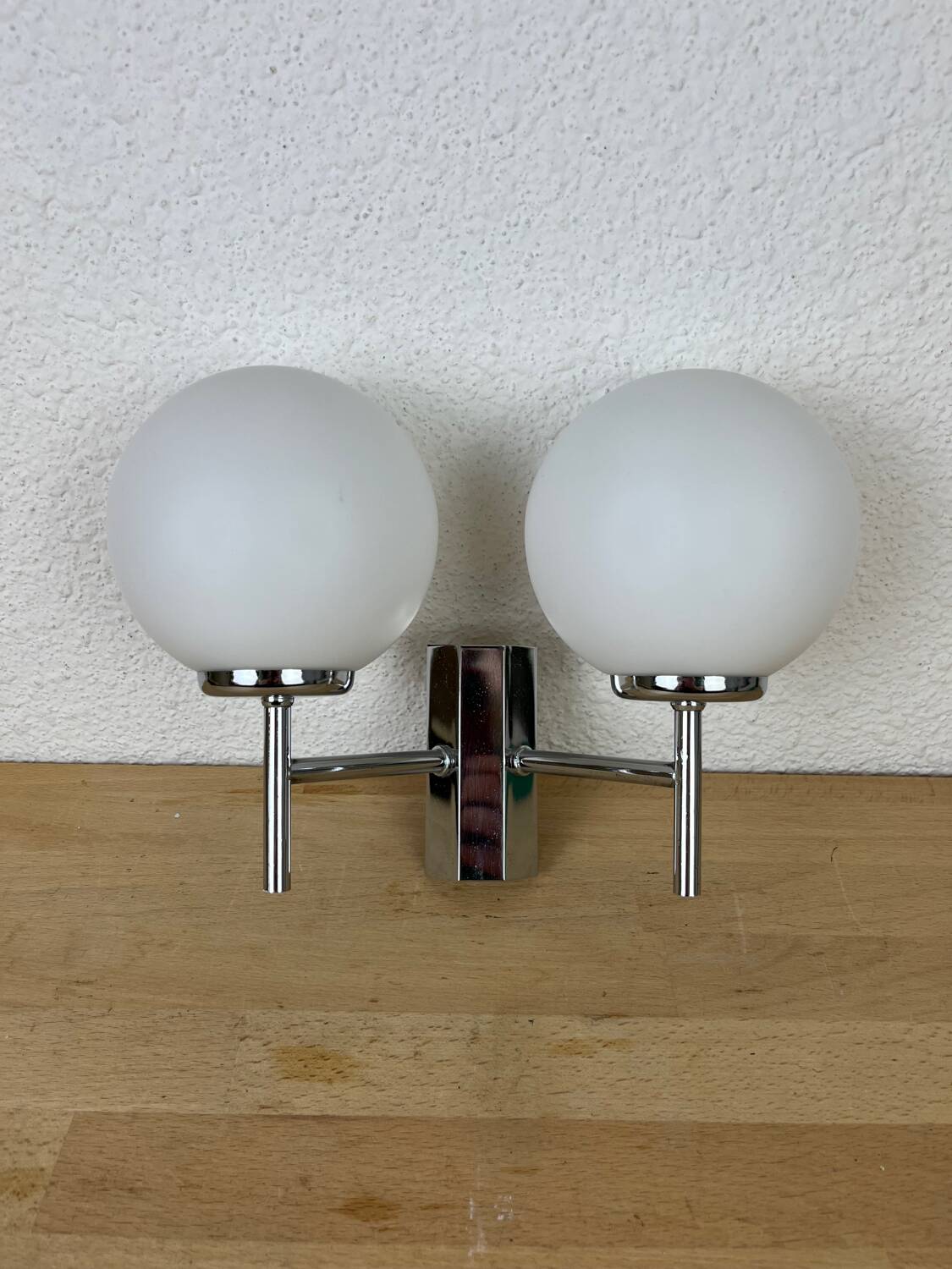Opaline and chrome globe wall light from the 1970s