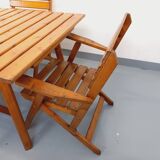 Vintage garden furniture set consisting of a table with extensions and 4 armchairs
