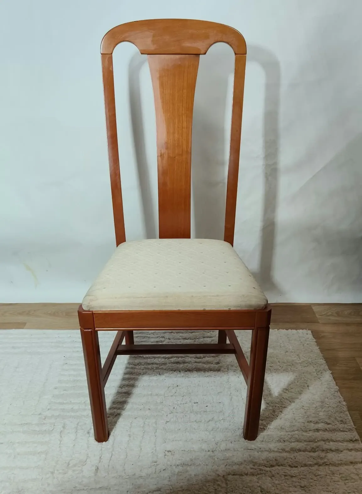 Set of 4 vintage chairs in stained wood and cream fabric.