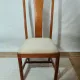 Set of 4 vintage chairs in stained wood and cream fabric.