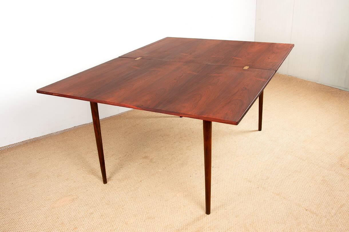 Danish extendable dining table in rosewood and brass by Poul Volther