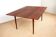 Danish extendable dining table in rosewood and brass by Poul Volther