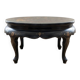 Asian coffee table in Chinese style made of black and gold lacquered wood.