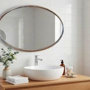 Oval Art Deco mirror with vintage chrome frame from the 1970s.