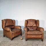 Beautiful pair of wide leather club armchairs with ears in Havana colour.