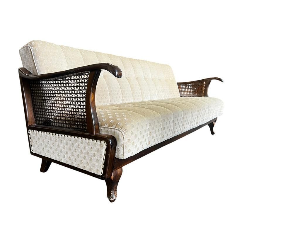 Vintage wooden armchair with rattan weaving.