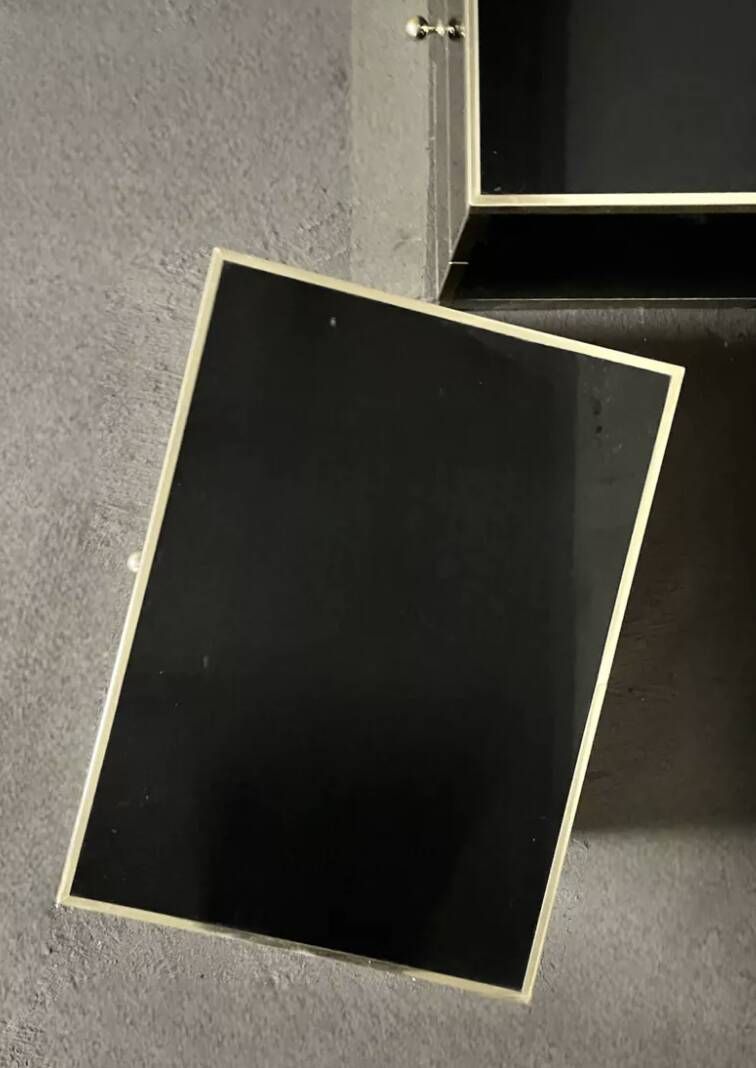 Pair of black lacquered and brass bedside tables, Roche Bobois 1970