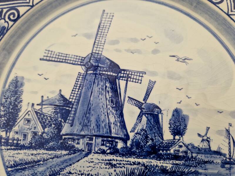 Delft Blue earthenware plate with a mill by a river decoration
