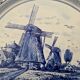 Delft Blue earthenware plate with a mill by a river decoration