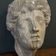 Antique plaster sculpture of a female face from the early 20th century
