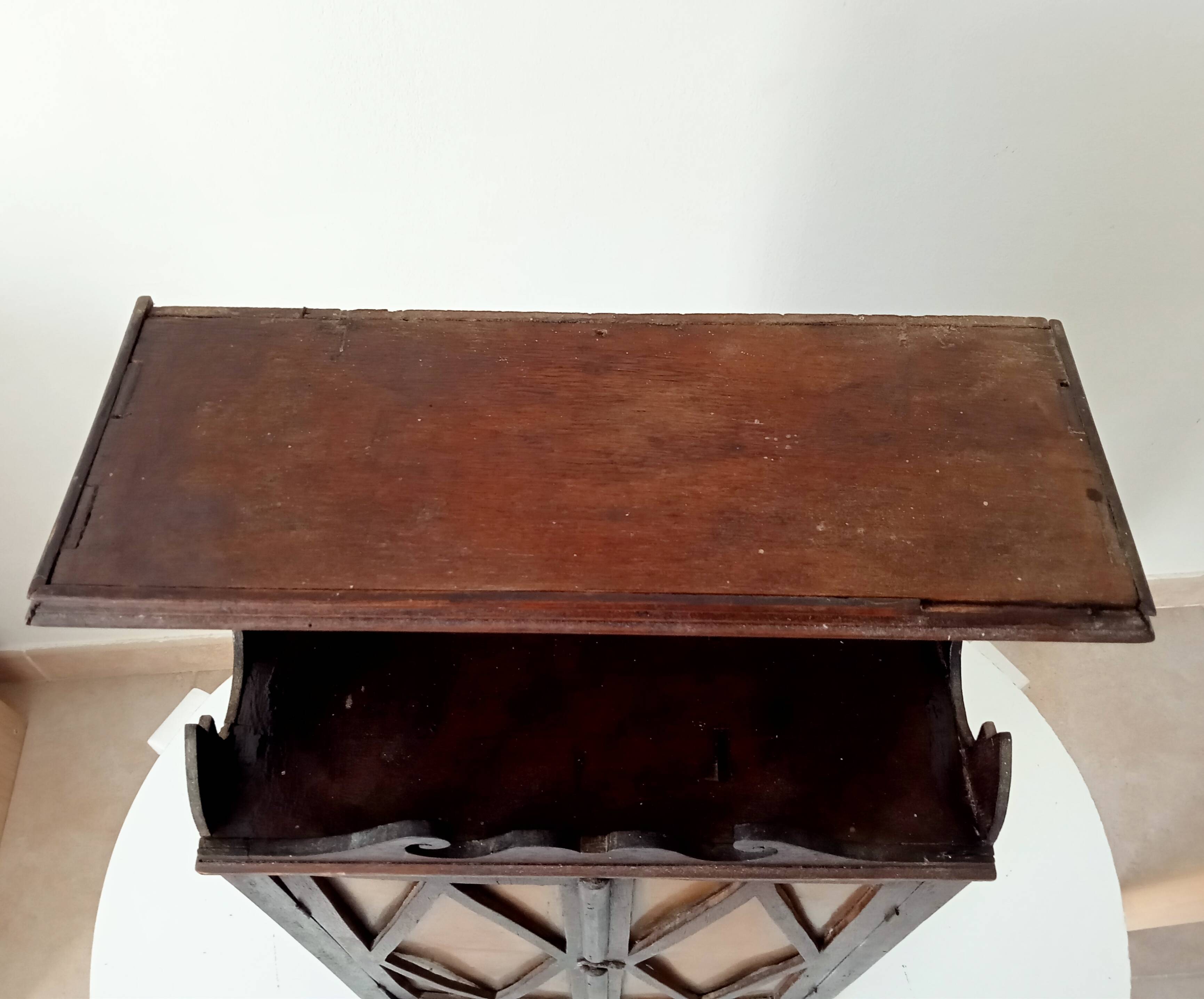 Small antique wall cabinet in Gothic style.