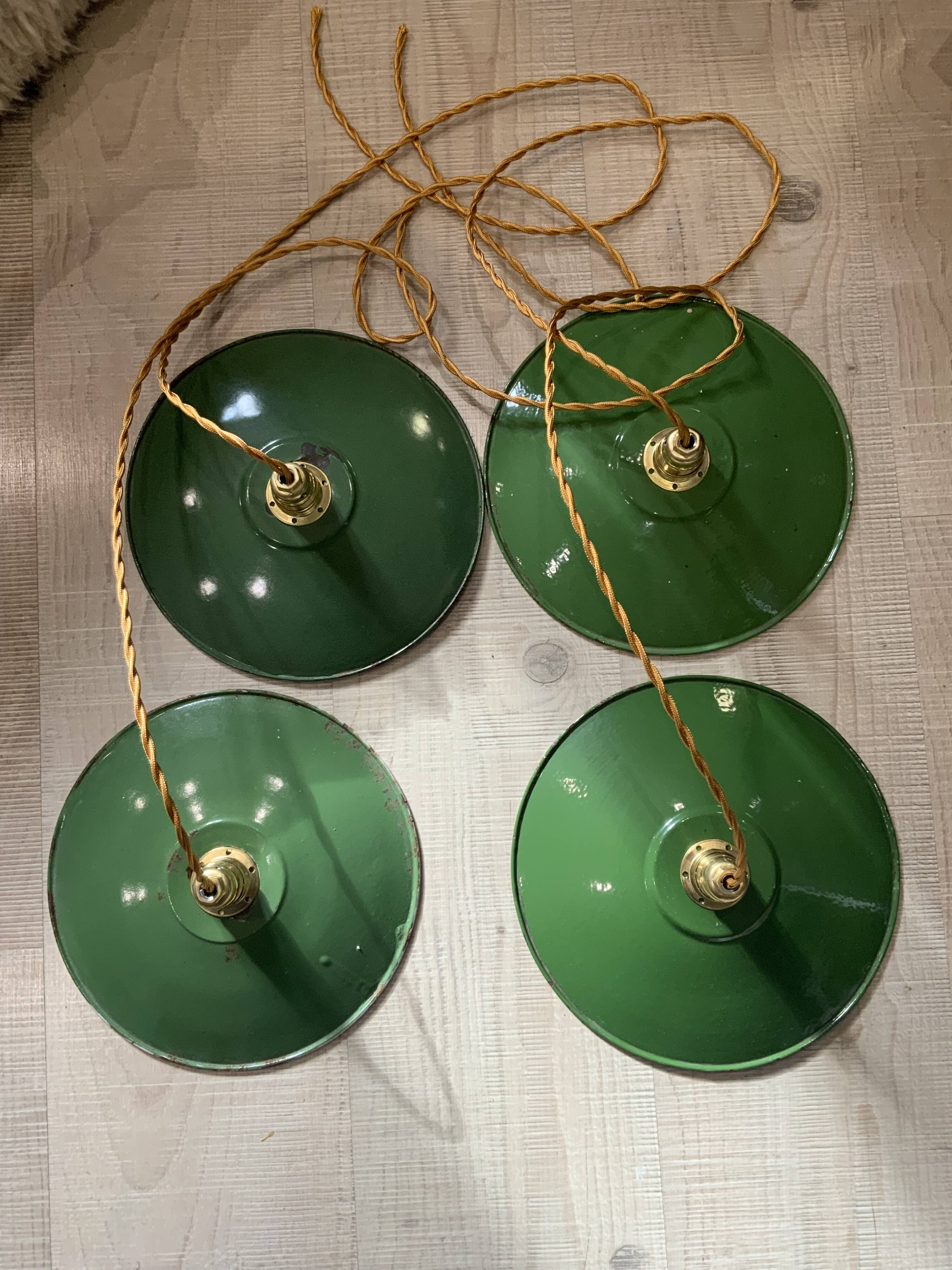 Vintage industrial enameled sheet metal pendant lights with golden wires, old green and white lampshade
