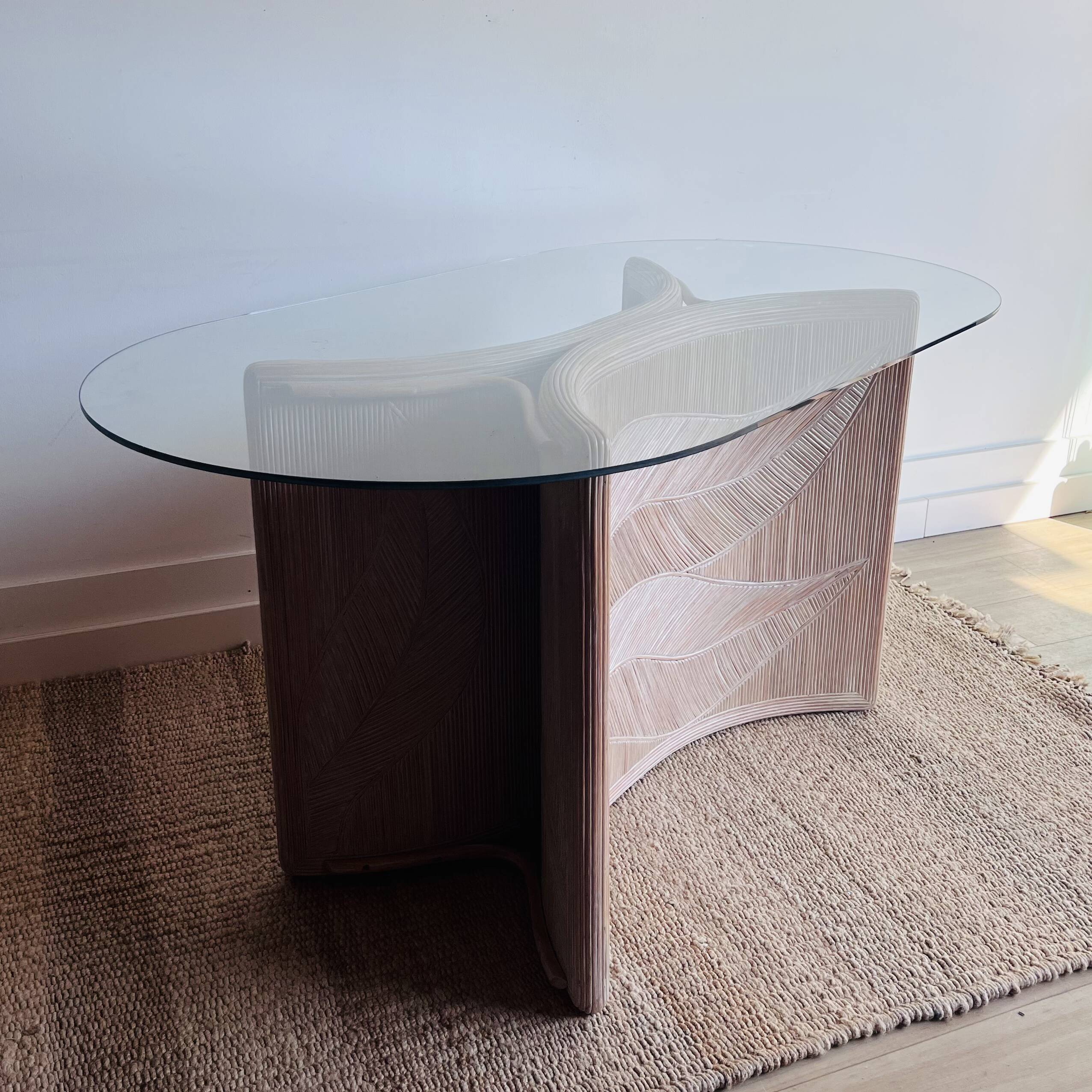 Italian side table with carved rattan and glass top.