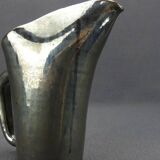 Old Biot, modernist pitcher in iridescent black ceramic.