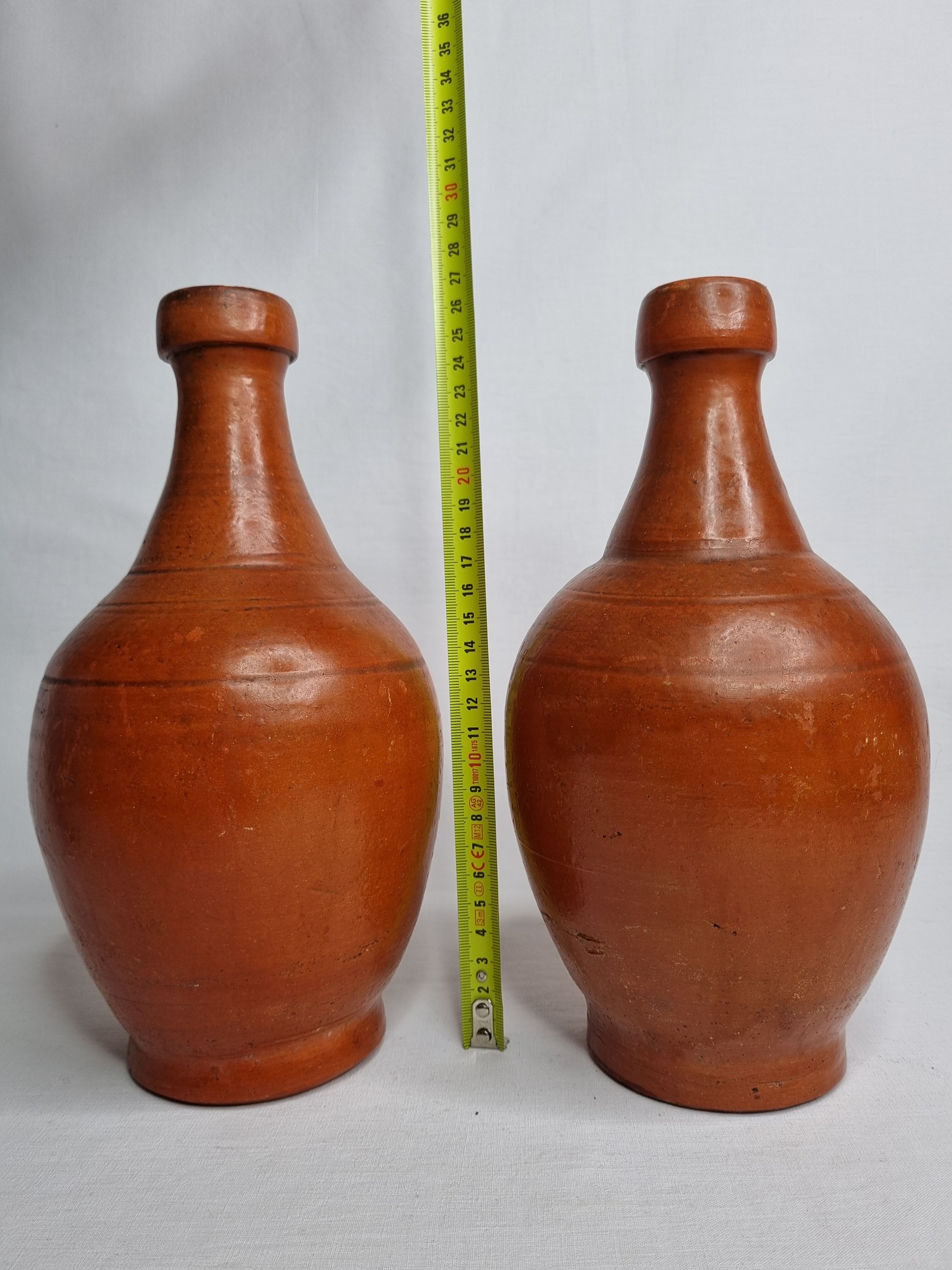 Pair of glazed terracotta jars, 26 cm