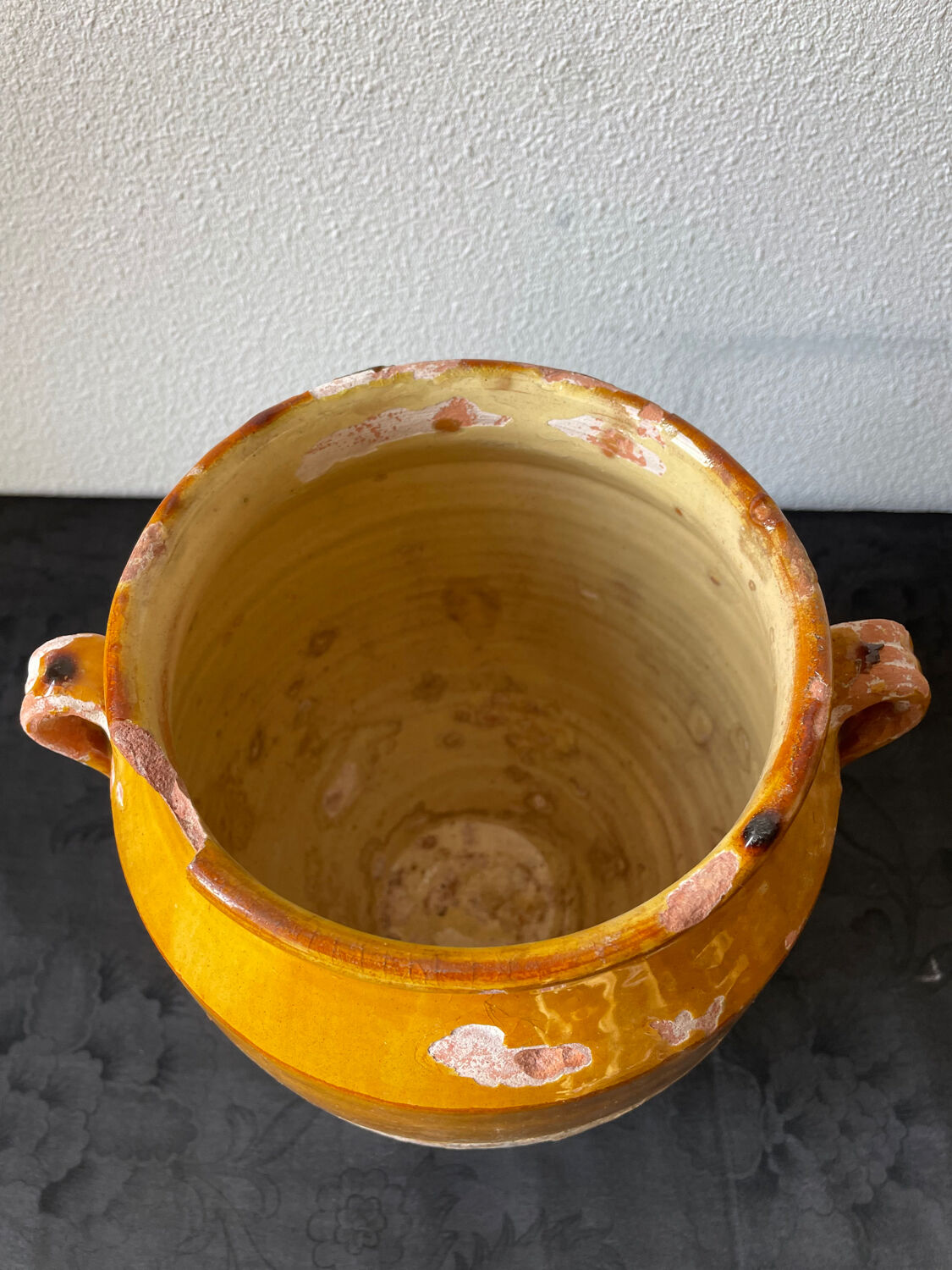 Old grease pot in glazed yellow terracotta, France nineteenth century