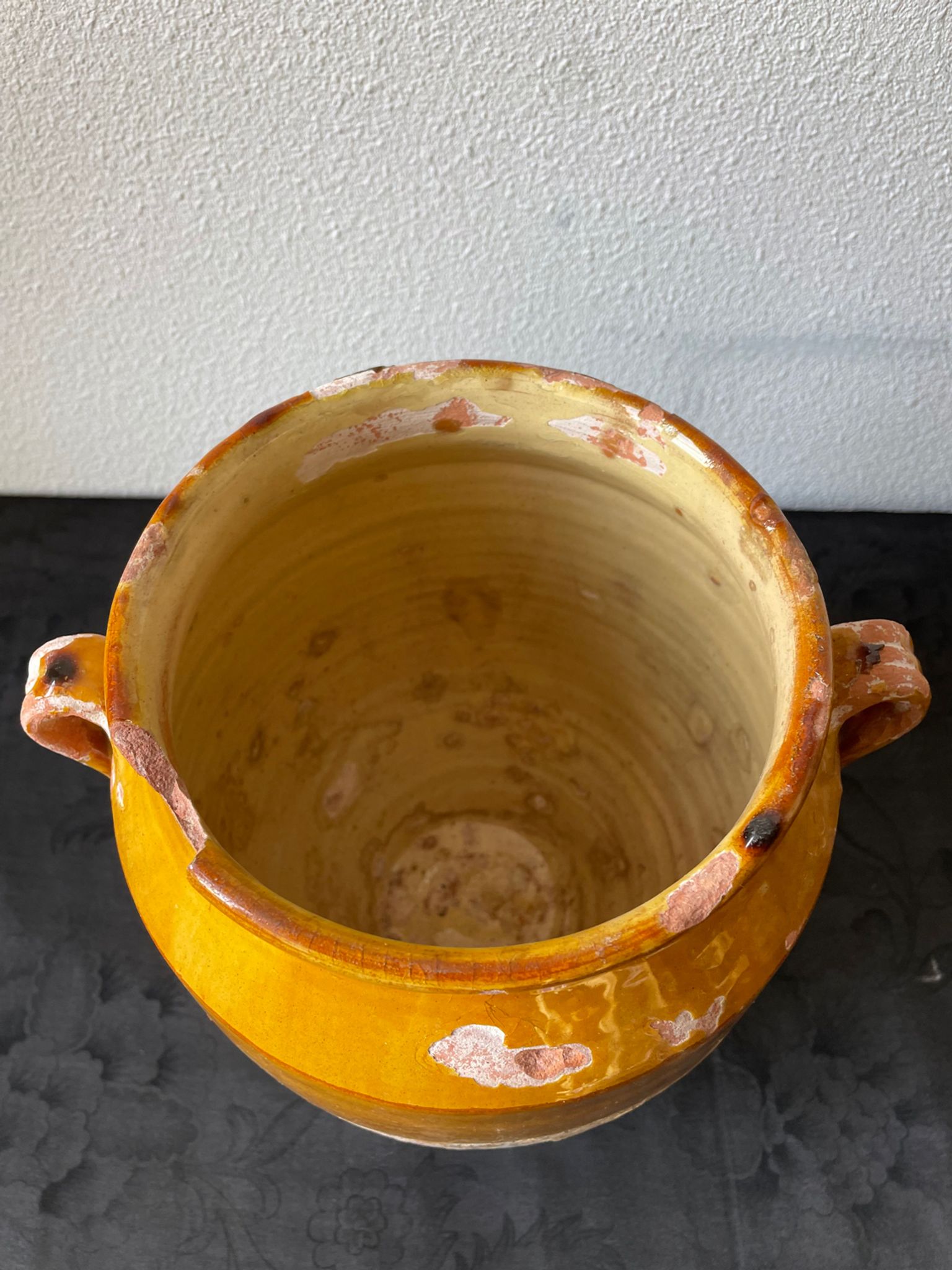 Old grease pot in glazed yellow terracotta, France nineteenth century