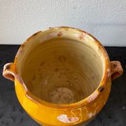 Old grease pot in glazed yellow terracotta, France nineteenth century