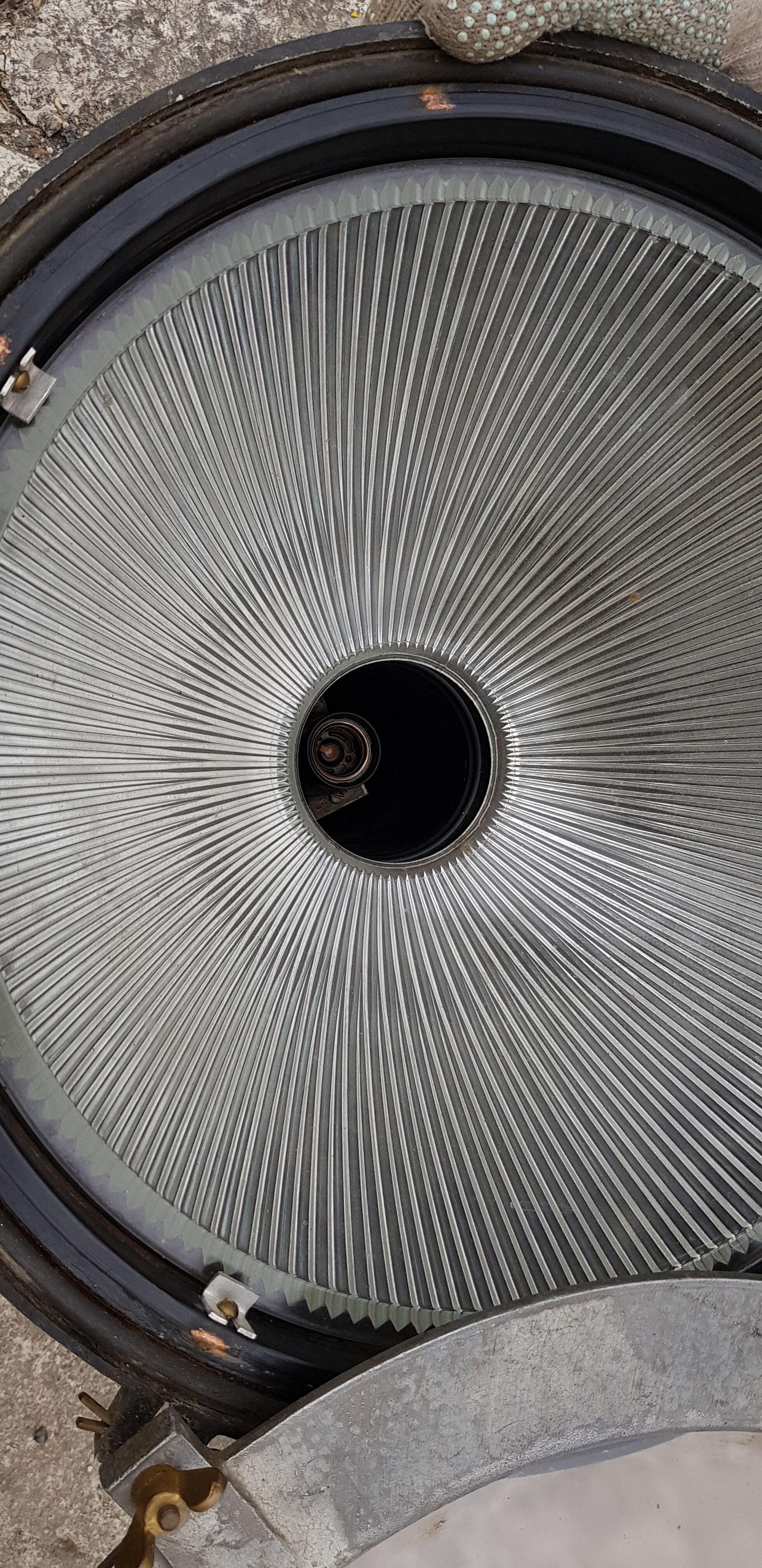 Old brass boat headlight with Holophane interior glass