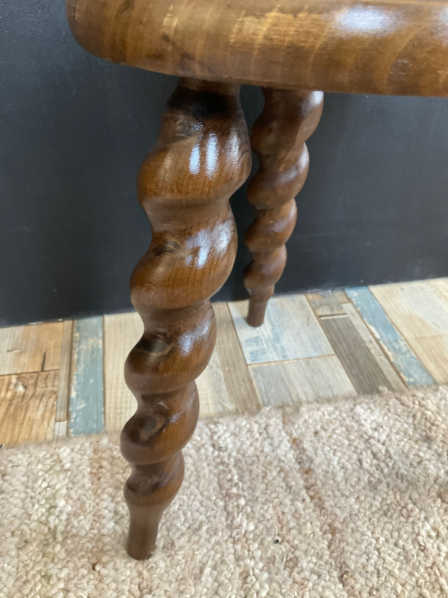 Antique tripod stool made of turned wood