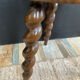 Antique tripod stool made of turned wood