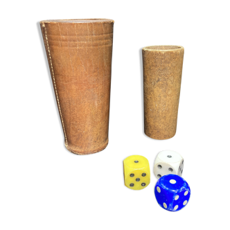 Two dice cups, one in leather and one in wood, supplied with three dice