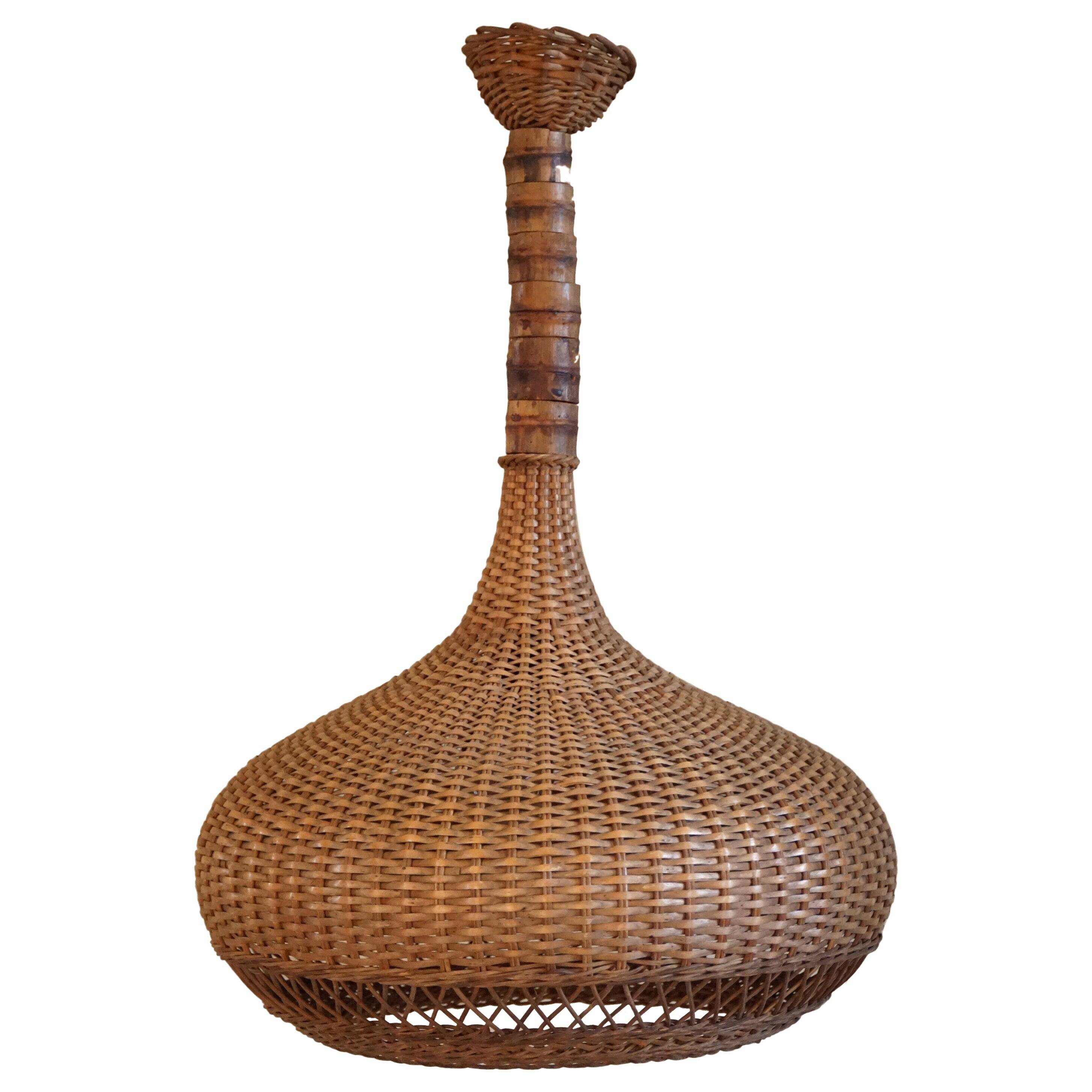 Vintage Danish mid-century rattan pendant light, made in the 1960s.