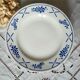 Old flat plates mismatched in earthenware