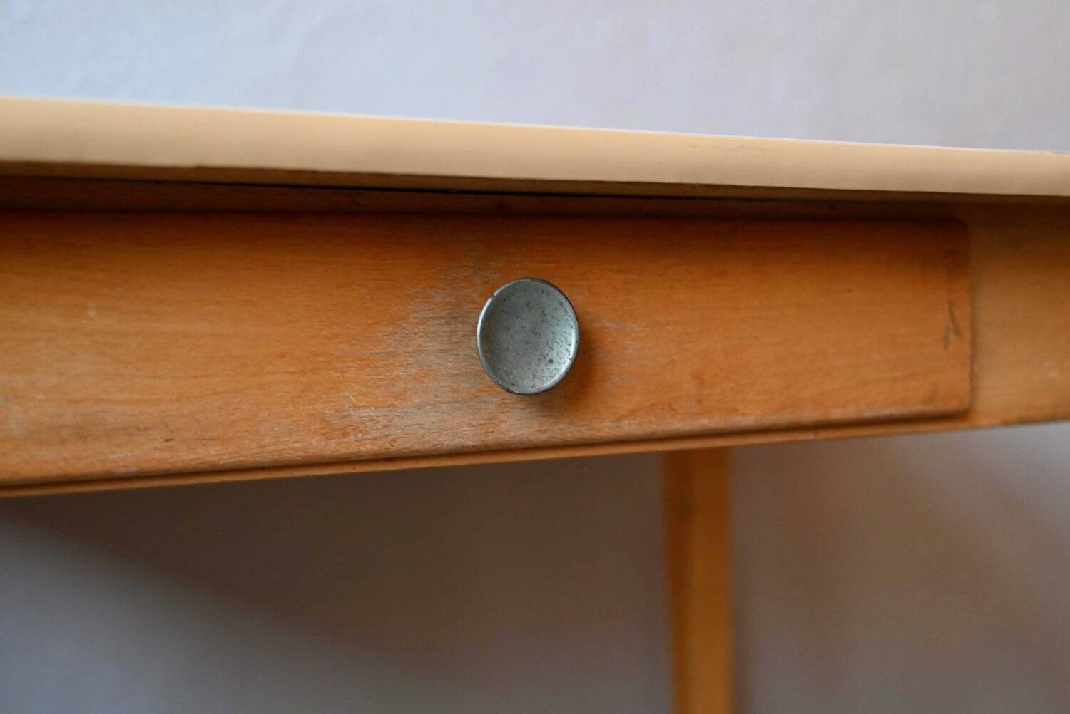 1950s Formica kitchen table with tapered legs and vintage drawer.
