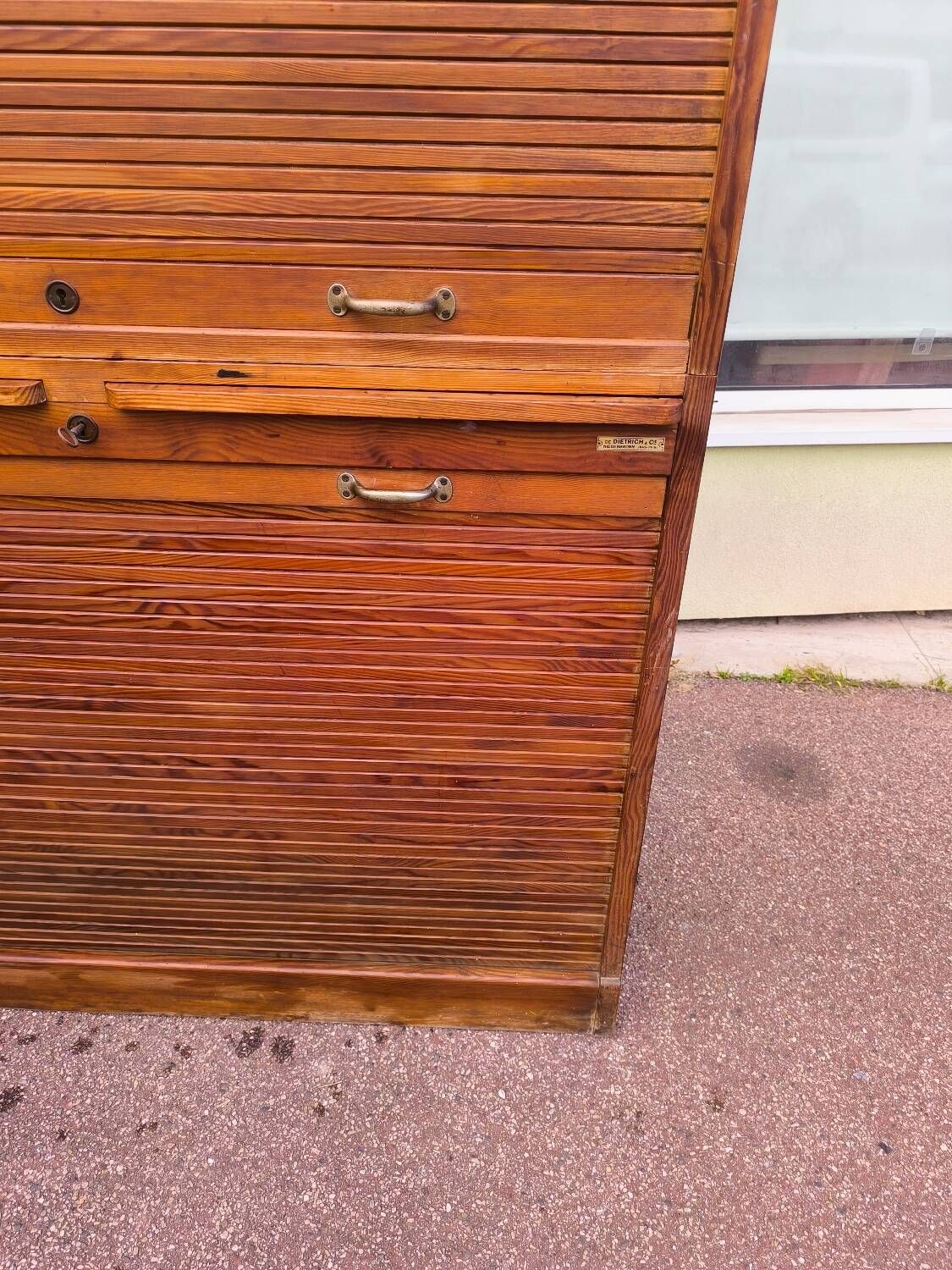 Vintage 1940s secretary desk with wooden curtains, storage, and shutters.