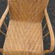 Antique high-back rattan armchair