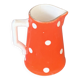 Milk jug, pitcher with white polka dots on orange earthenware, Sarreguemines and Digoin