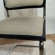 Cesca B32 chair by Marcel Breuer, upholstered in beige fabric.