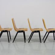 Set de 4 chaises empilables par Roland Rainer