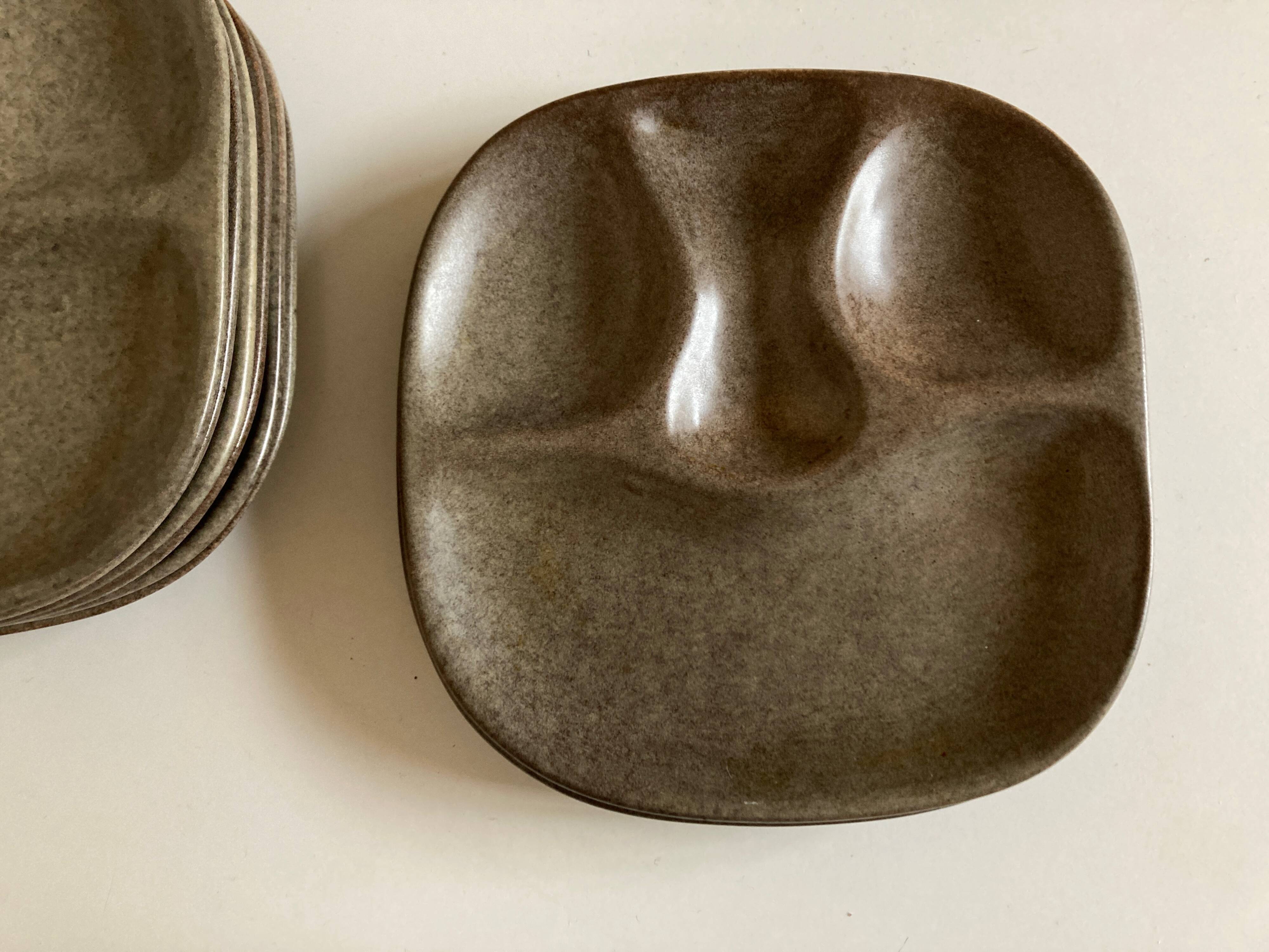 Set of 8 mid century modern stoneware potter's plates to identify