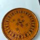 Round top in carved wood and vintage varnish