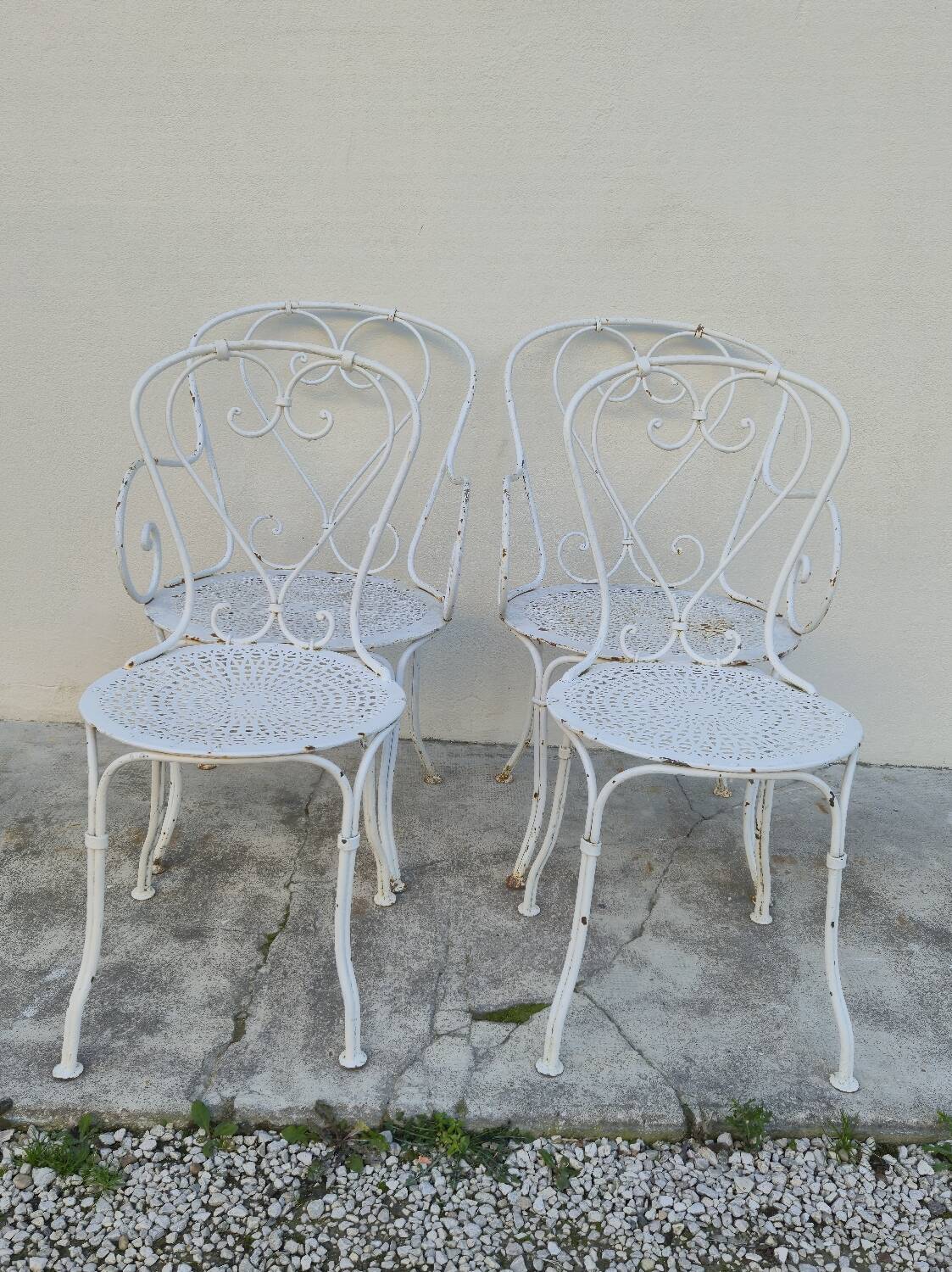 Garden furniture, two armchairs and two wrought iron chairs, period 1