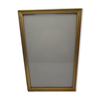 Old wooden and gilded stucco frame