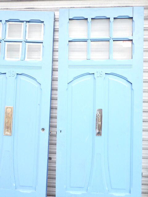 Double front door, fir and windows at the top
