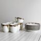 7 Limoges porcelain cups and saucers with gold decoration and floral motif.