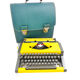 Machine à écrire Olympia AEG Dactymétal De Luxe Jaune révisée ruban neuf avec valise verte