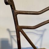 Wrought iron chair with woven seat